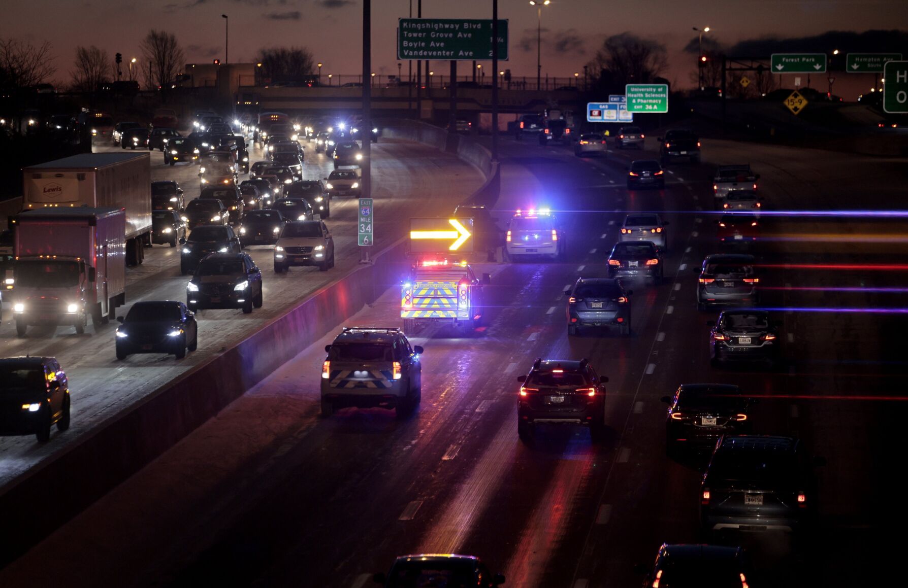 Slick, snowy road conditions slow traffic this morning
